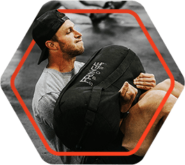 Photo icon of man doing a situp with a heavy bag
