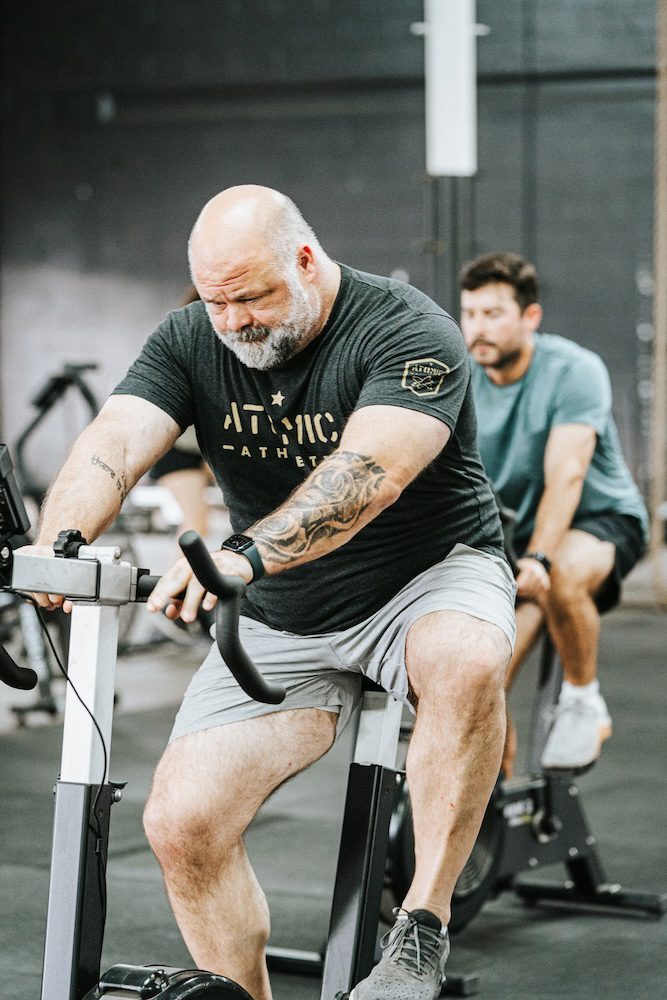 Older guy riding a stationary bike